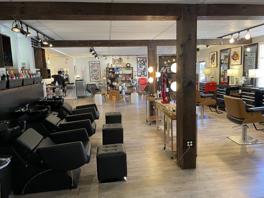 Professional hair salon interior with styling stations and modern equipment